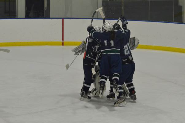 The girls hockey team is filled with excitement after a huge win.