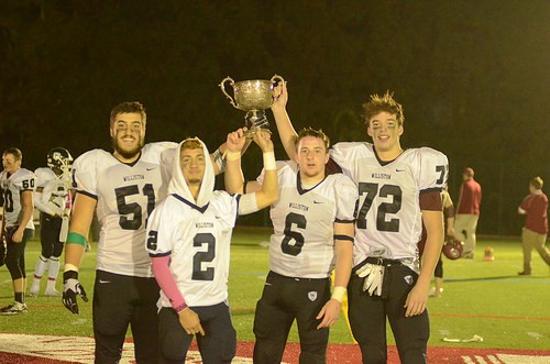 Williston captains hoist the Miller Cup after a great win over The Gunnery. 