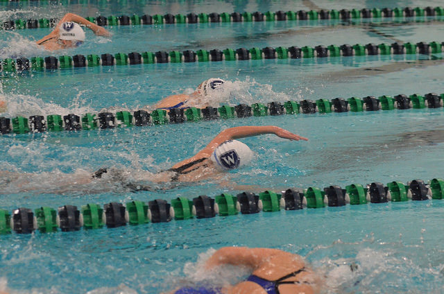 Girls Varsity Swimming in a meet against Worcester Academy. 