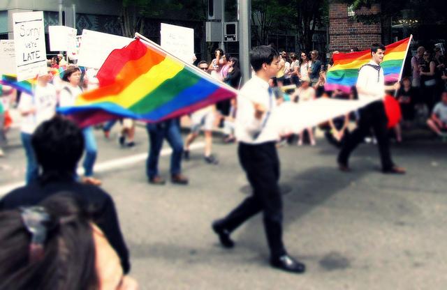 Activists fly gay pride flags in support of same-sex marriage.