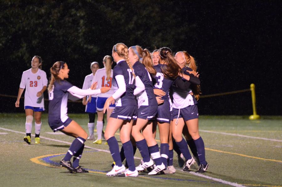 The GV Soccer team celebrates during its 3-0 victory over rival WMA on Friday night under the lights. Courtesy of Olivia Cuevas 16