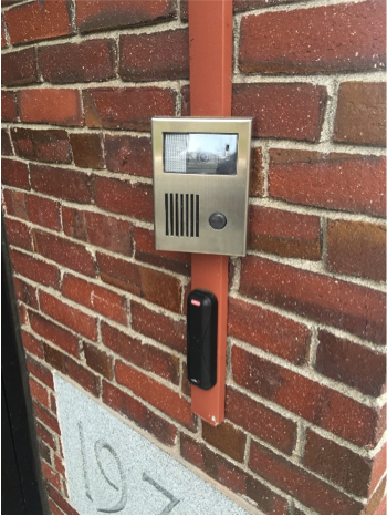The card swipe lock outside of the Middle School. The metal box is a camera and microphone, and the black box is where students can swipe their Sammy card.
