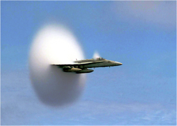 This is an F/A-18 Hornet entering supersonic travel causing a vapor cone to form.