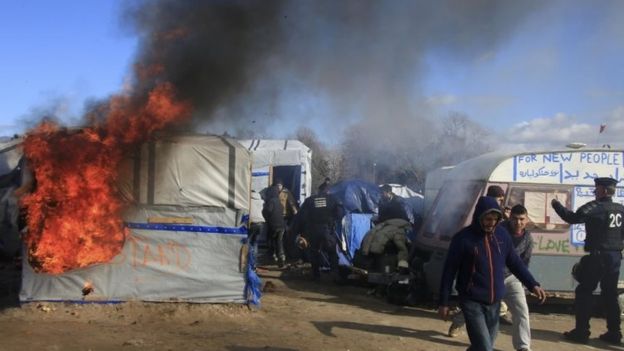 A violent eviction at "The Jungle" refugee camp.
Credit: AmirahBreen via Wikimedia