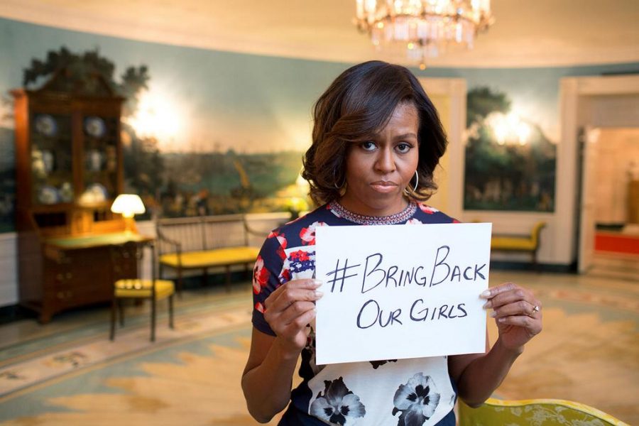 Michelle+Obama+holds+a+sign+with+the+%23BringBackOurGirls+hashtag%2C+drawing+attention+to+the+plight+of+the+kidnapped+students.