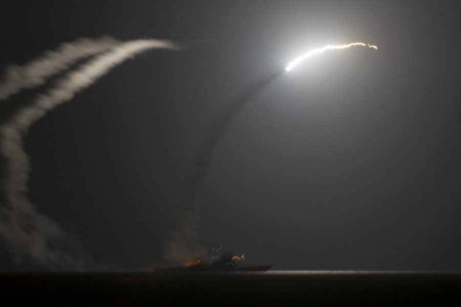 Photo shows Tomahawk missile being fire from the USS Philippine Sea and the USS Arleigh Burke at IS targets. Credit: Public Domain