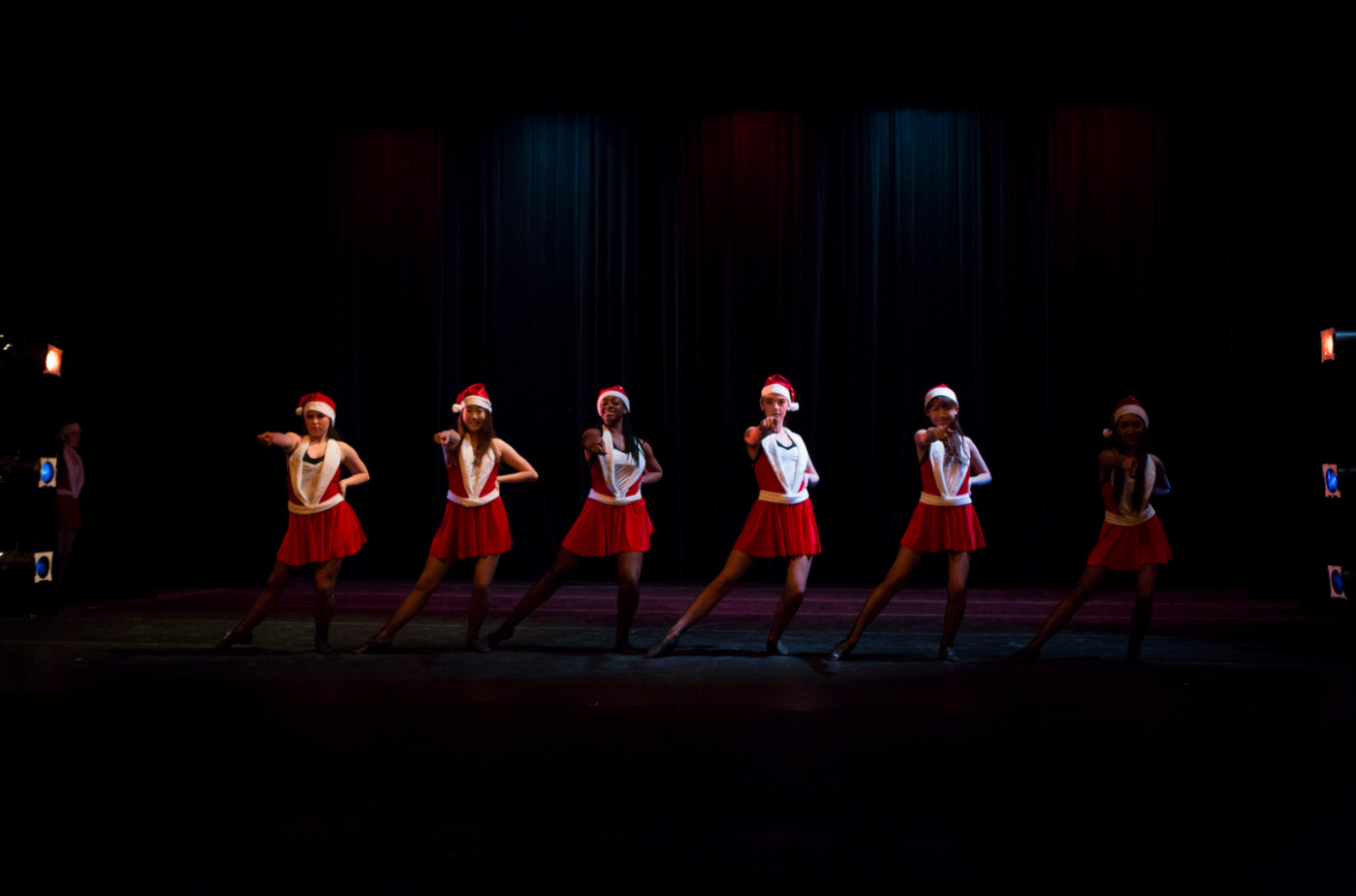 Gabby (far left), Destiny (third from left), and Makenna (fourth from left) perform as Rockettes in the fall dance concert Contagion. Credit: Flickr.