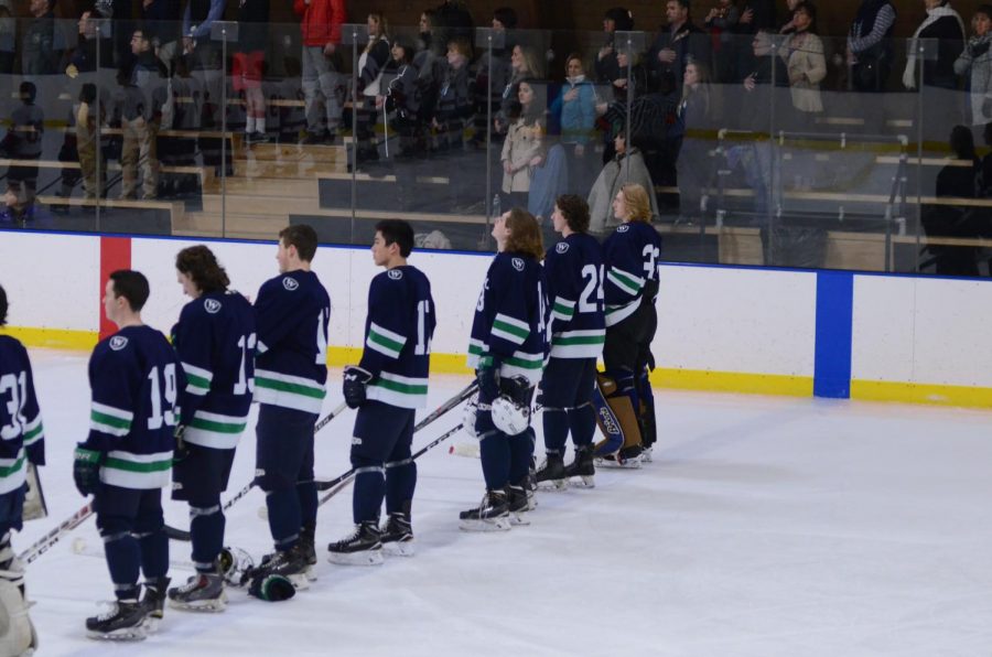 Hockey players line up during the National Anthem at Senior Night 2017 against Pomfret. Credit: Williston Flickr.