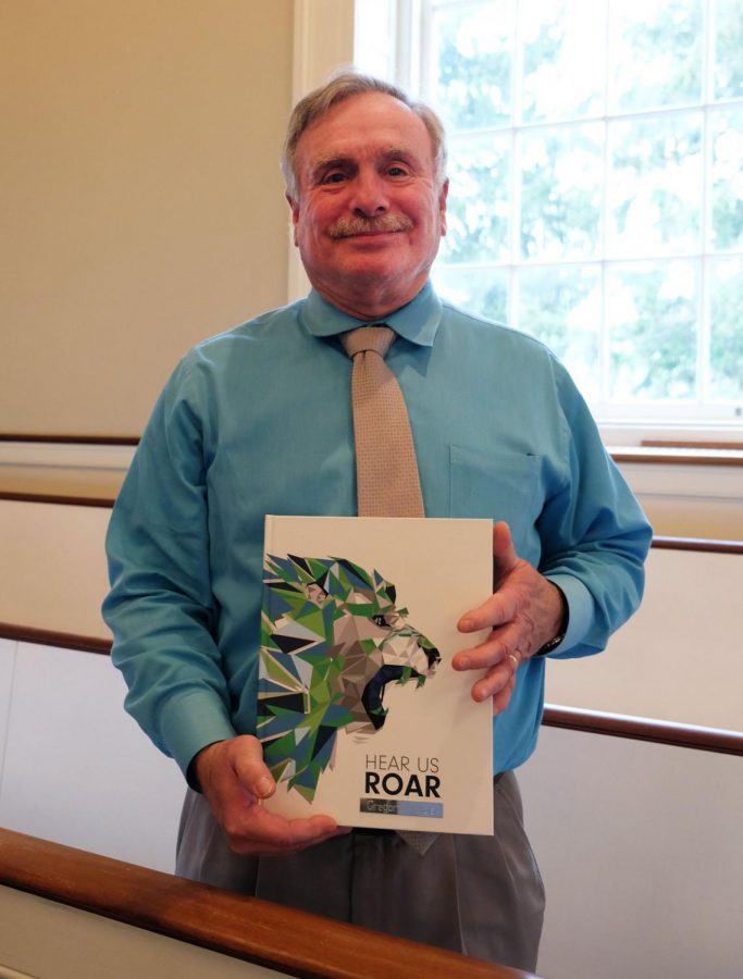 Tuleja with the 2019 yearbook, which was dedicated to him.