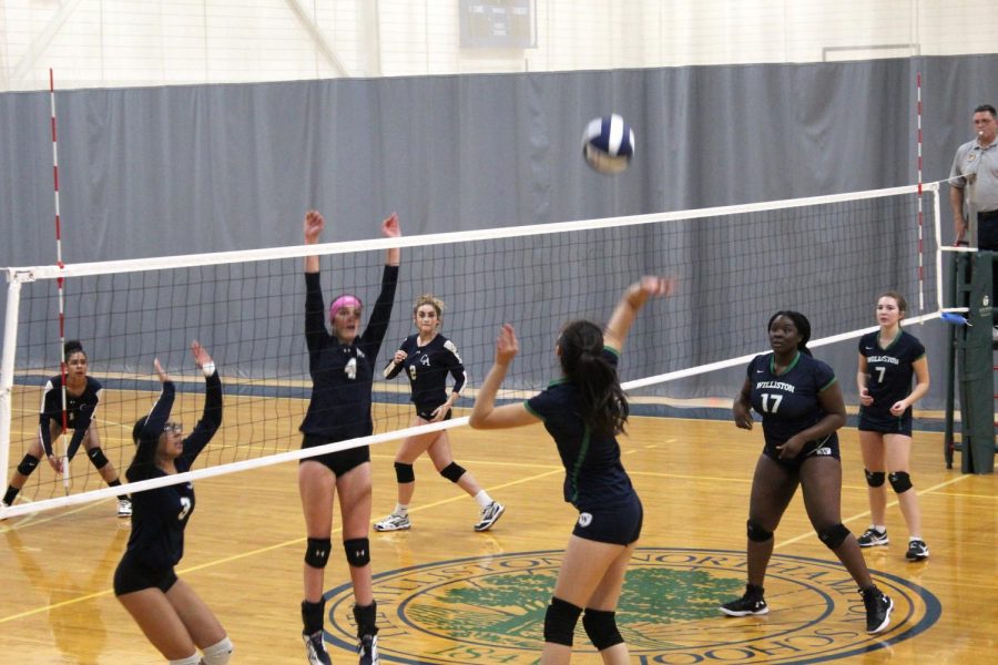The volleyball team in a 2018 game against Cheshire.