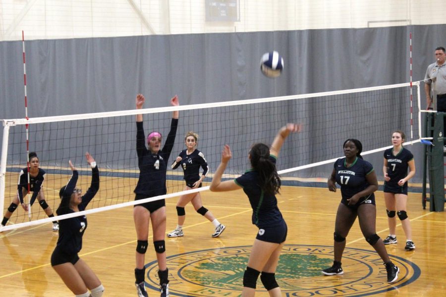 The volleyball team in a 2018 game against Cheshire.